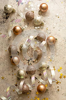 Christmas baubles with star shaped glitter and snow. Copy space