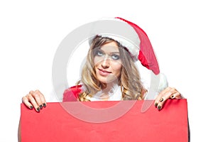 Christmas. Beautiful muscular sexual happy woman in Santa Claus clothes. Keeps blank whiteboard. Isolated on white