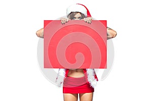 Christmas. Beautiful muscular sexual happy woman in Santa Claus clothes. Keeps blank whiteboard. Isolated on white