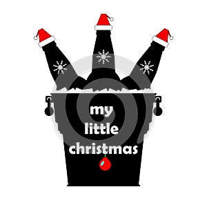 Christmas beer bottles in santa claus hats in a metal bucket with ice cubes and snowflakes . The inscription `my little christmas`
