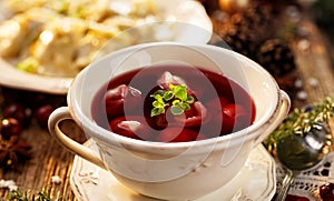 Christmas beetroot soup, borsch with small dumplings with mushroom stuffing, traditional Christmas soup in Poland
