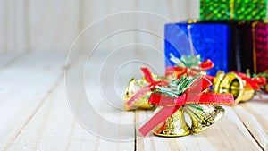 Christmas bell with a red bow and gift box