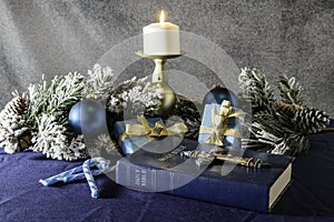 Christmas bible cross and candy canes on blue