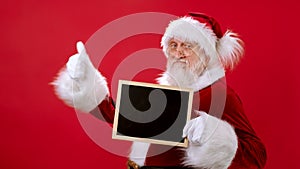 Christmas Billet Advertising for Your Mock Up Text With Black Friday Sale or Online Sale. Santa Claus Picks Up an Empty
