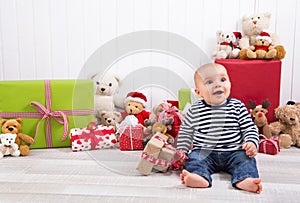 Christmas and birthday - cute baby sitting barefoot and looking