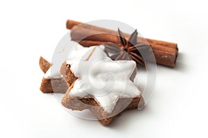 christmas biscuit shaped star with anise flower and cinnamon stick on white background