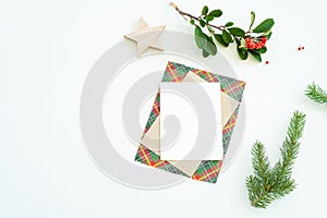 Christmas blank greeting card mock-up scene. Christmas decoration composition on white background with blank greeting card and