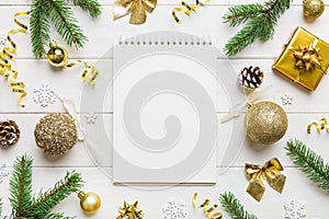 Christmas blank greeting card mock-up scene. Creative layout made of Christmas tree branches and paper card note. Flat