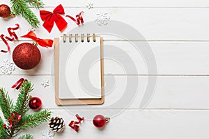 Christmas blank greeting card mock-up scene. Creative layout made of Christmas tree branches and paper card note. Flat