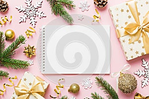 Christmas blank greeting card mock-up scene. Creative layout made of Christmas tree branches and paper card note. Flat