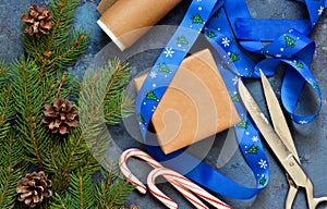 Christmas blue background with gift boxes and xmas tree.