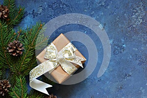 Christmas blue background with gift boxes and xmas tree.