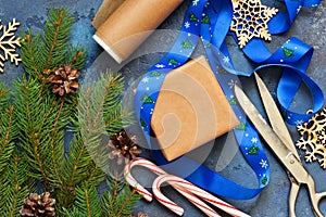 Christmas blue background with gift boxes and xmas tree.