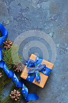 Christmas blue background with gift boxes and xmas tree.