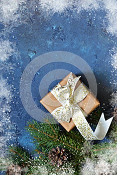 Christmas blue background with gift boxes and xmas tree.