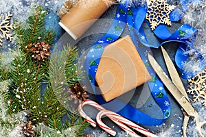 Christmas blue background with gift boxes and xmas tree.