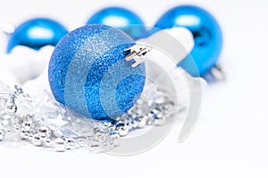 Christmas blue ball in focus and blue balls in background with