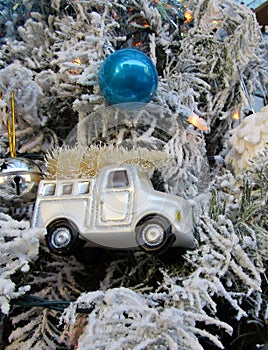 Christmas blue ball and silver track with golden tree ornaments hanging on white tree