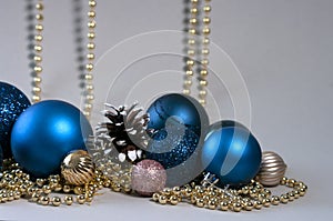 Christmas blue balls with golden decorations and pine cone, giftcard