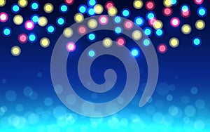 Christmas bokeh background. Color defocused lights on blue backdrop. Abstract shining circles. Unfocused soft glow photo