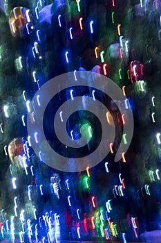 Christmas bokeh of blurred stripes of circles. vertical photo format