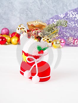 christmas boot stocking filled gifts ,sprig Christmas tree holly and lollipop stick