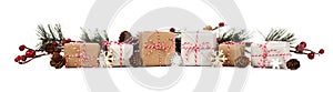 Christmas border with branches and brown and white gift boxes on white