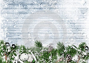 Christmas border with fir branches, jingle bells and snowfall. G photo