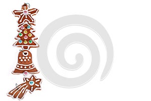 Christmas border with gingerbread cookies isolated on white