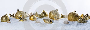 Christmas border with golden ornaments