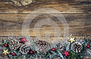 Christmas border with pine cones, stars and balls decoration