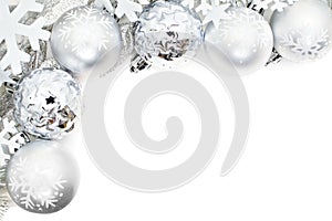 Christmas border of snowflakes and silver baubles