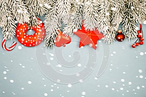 Christmas border. Winter background with snow and red Xmas decorations