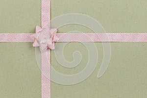 Christmas Bow and ribbon on brown paper background