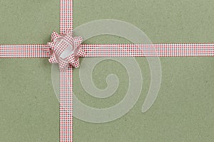 Christmas Bow and ribbon on brown paper background