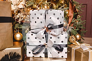 Christmas boxes with gifts with black ribbons