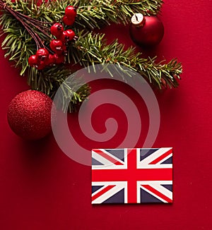 Christmas, boxing day and United Kingdom flag, traditional holiday gifts, presents on red background flat lay, wrapped