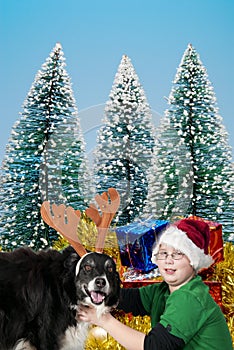 A Christmas boy and his reindeer dog
