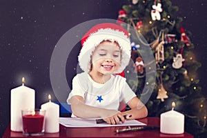 Christmas boy writing letter to Santa