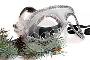 Christmas branches with carnaval mask photo