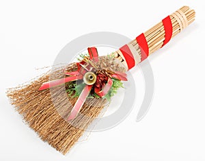 Christmas broom decorations isolated on white