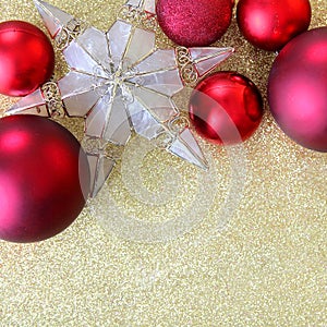 Christmas Bulbs and Star Tree Topper Framing Gold Glitter Backgr