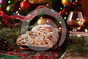 Christmas Cake and Celebration Decorations. Traditional German Stollen with Berries, Nuts, Marzipan.