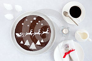 Christmas Cake and a Cup of Coffee with Christmas Decoration