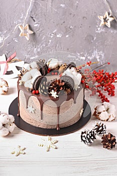 Christmas cake with flowers and chocolate. Wedding details - wedding cake.