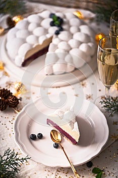 Christmas Cake Or French Christmas Cake call `BÃÂ»che de NoÃÂ«l` in France with Blueberry Mousse and White Chocolate Ganache photo