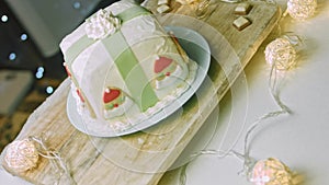 Christmas cake with gingerbread cookies in the shape of Santa Claus