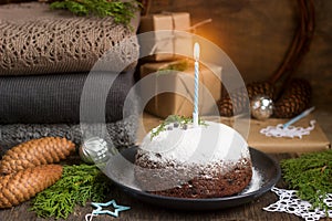 Christmas cake or pudding in festive decoration.