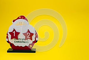 Christmas calendar counting down the days of a wooden Santa Claus