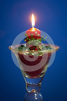 Christmas candle with blue background